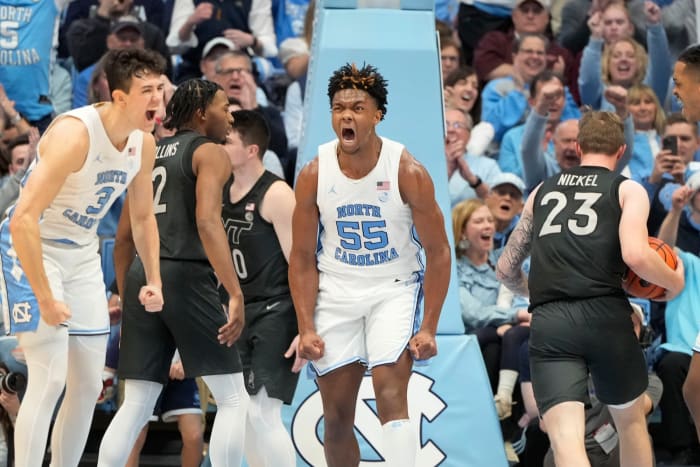 North Carolina Tar Heels forward Harrison Ingram (55) reacts with guard Cormac Ryan (3) after scoring in the first half at Dean E. Smith Center in Chapel Hill, North Carolina, on Feb. 17, 2024.